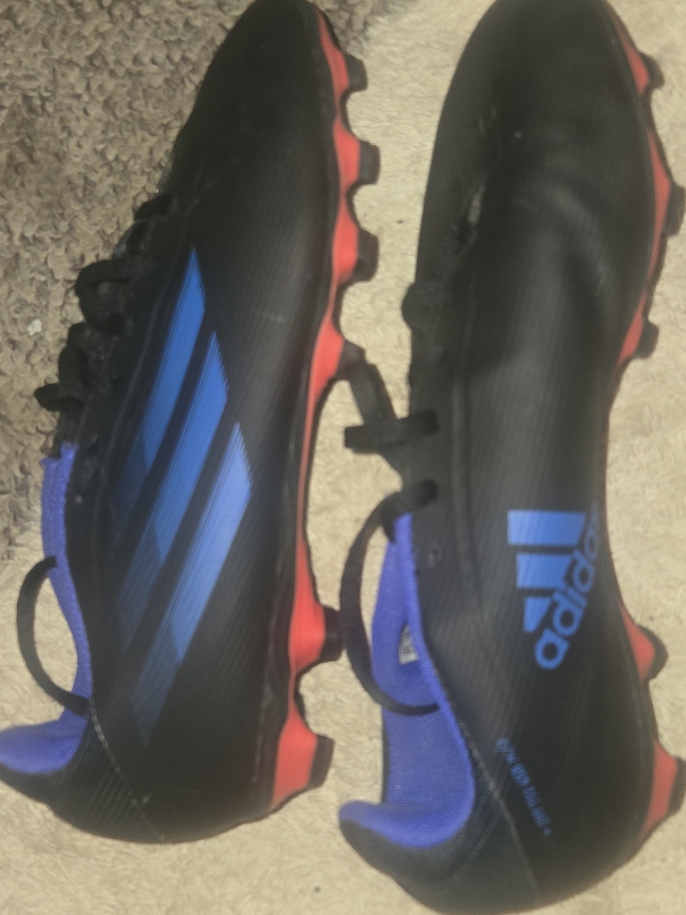 adidas Men’s Black Soccer Cleats with Blue Accents and Red Studs